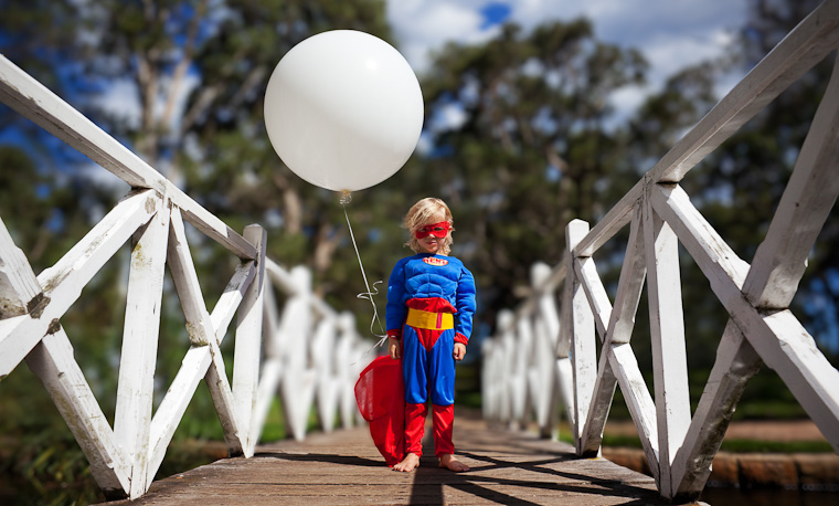 Family photography in Centennial Park, Sydney. Boy surrounded by nature.