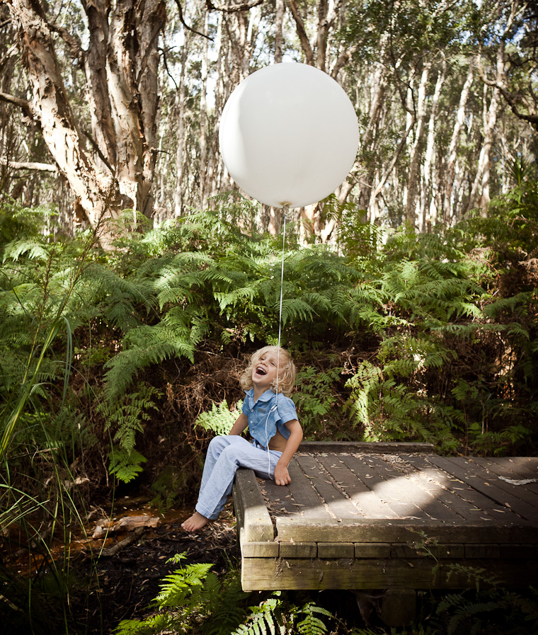 Family photography in Centennial Park, Sydney. Boy surrounded by nature.
