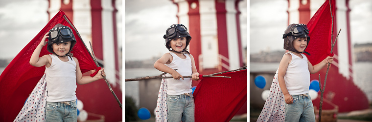 Boy at lighthouse, styled shoot with red and white theme.