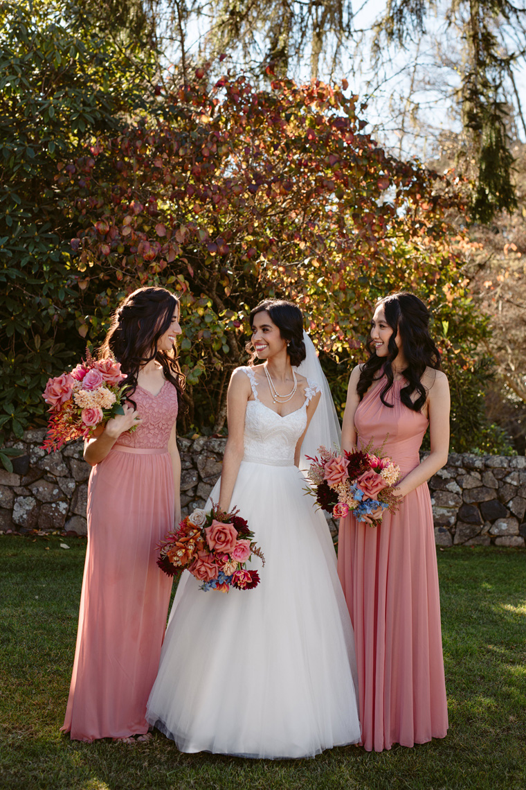 Bridesmaids gathered in sunny winter garden.