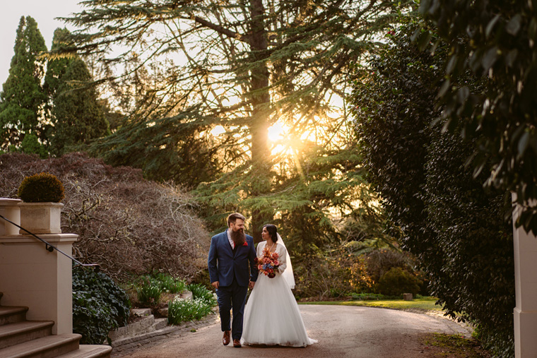 Couple walk down the path infront of the Milton Park hotel