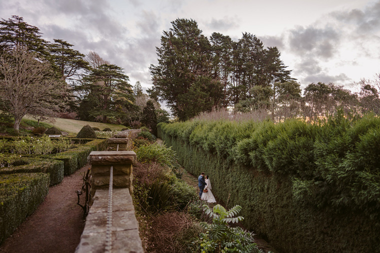 Wide photo of a couple embracing along the Alpine Walk.