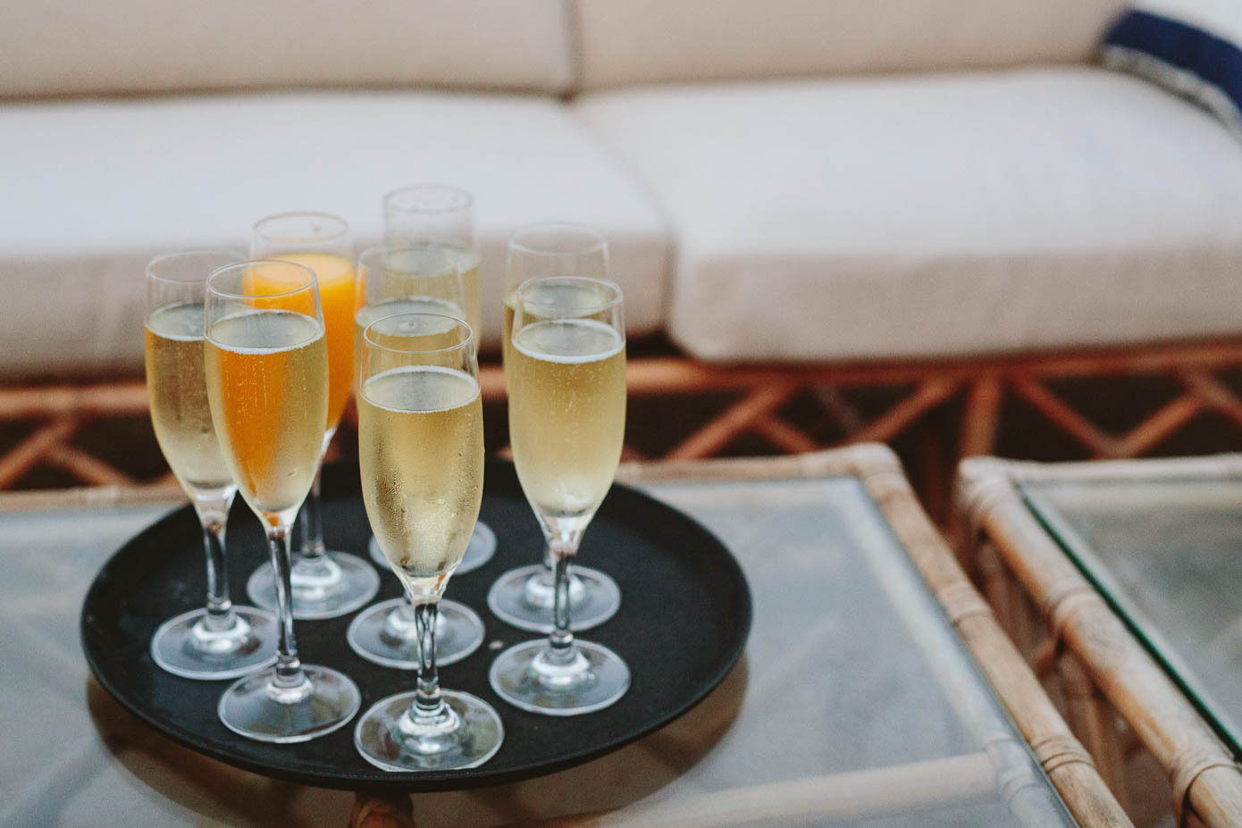 A tray of sparkling champagne flutes, ready to toast to the newlyweds at the reception.